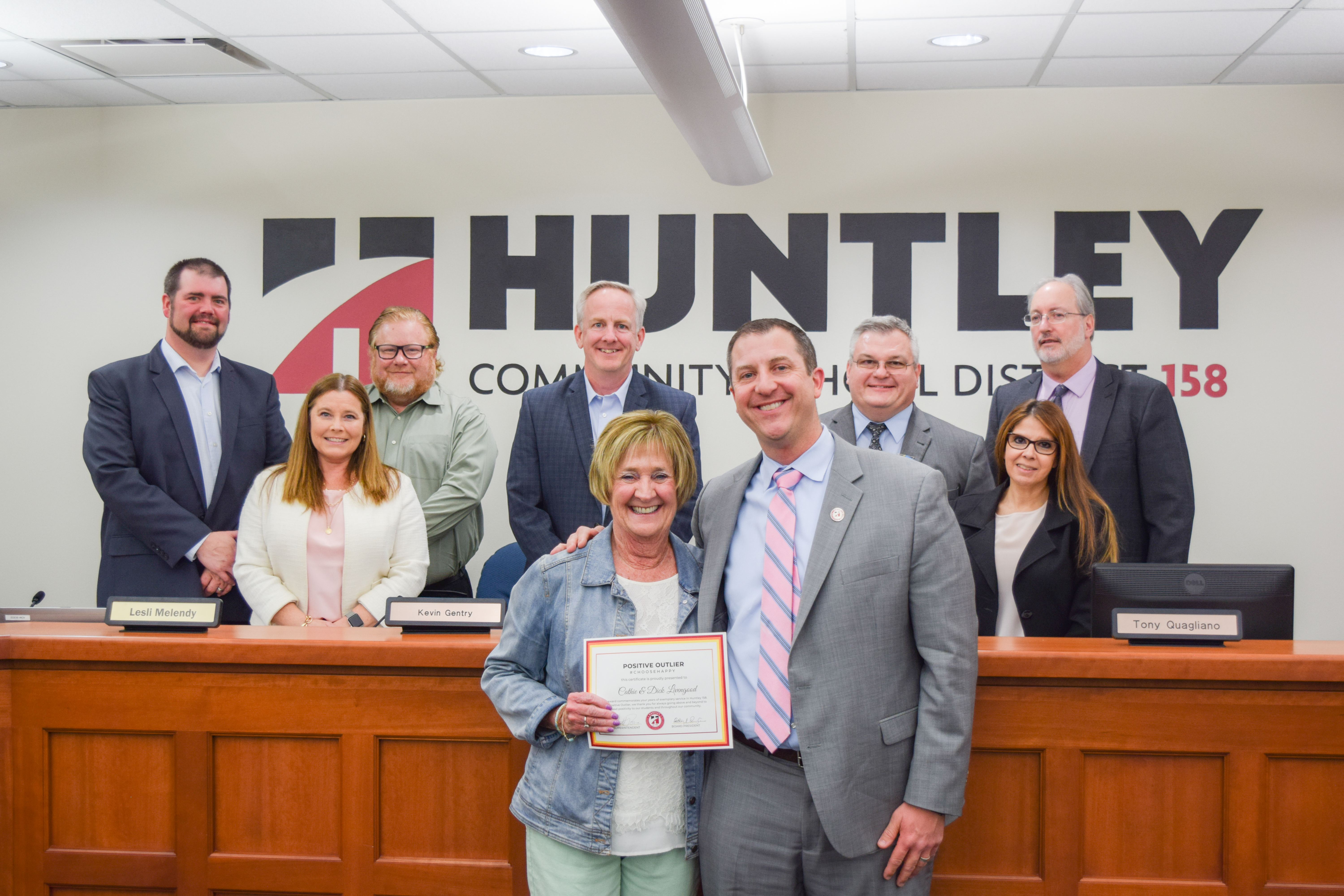 members of the Board with Huntley 158's Positive Outlier, substitute teacher Cathie Livengood